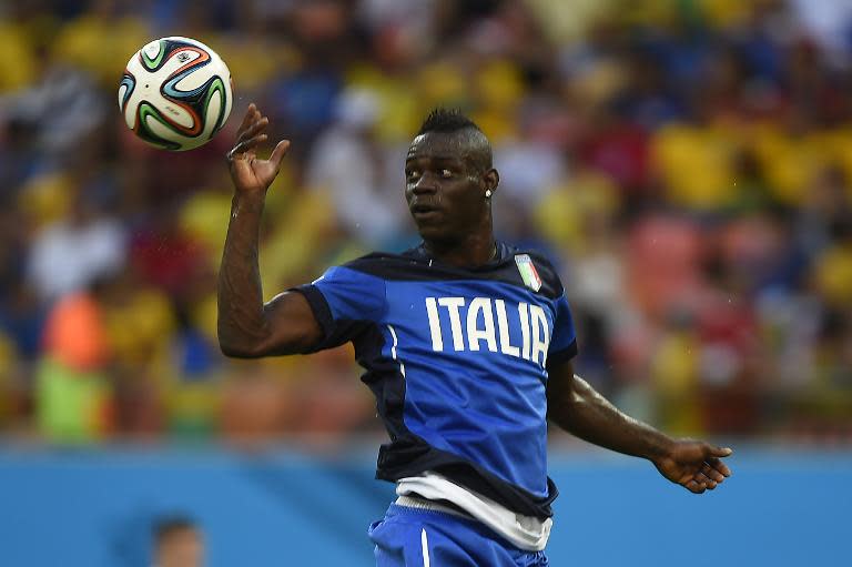 Italy striker Mario Balotelli warms up prior to a World Cup match between England and Italy at the Amazonia Arena in Manaus, Brazil, on June 14, 2014