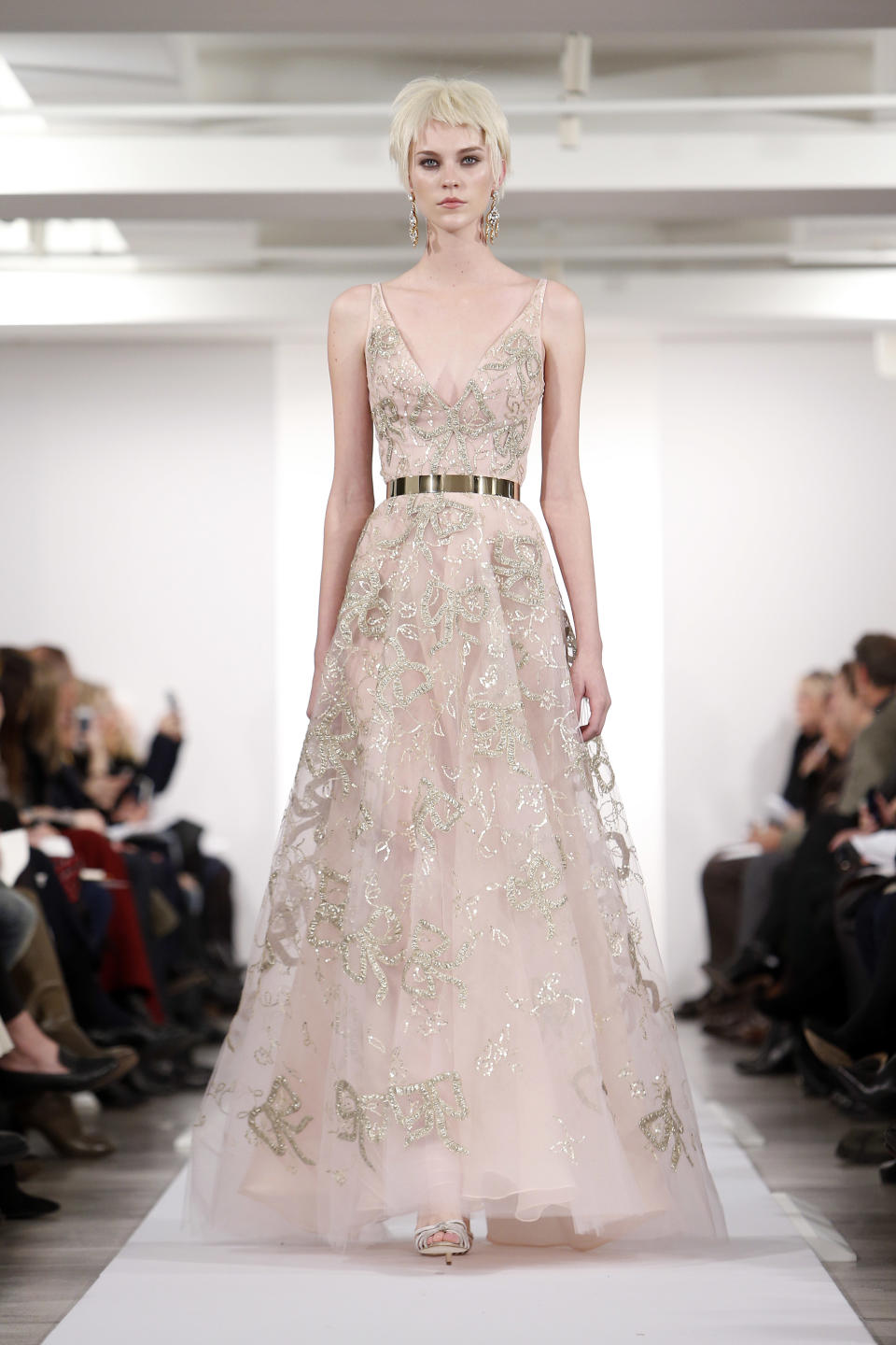 The Oscar de la Renta Fall 2014 collection is modeled during Fashion Week in New York, Tuesday, Feb. 11, 2014. (AP Photo/Jason DeCrow)