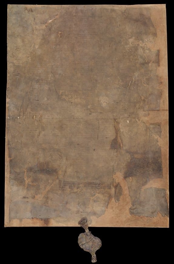 A full view of the 1215 Burnt Magna Carta that was damaged in a fire in 1731.