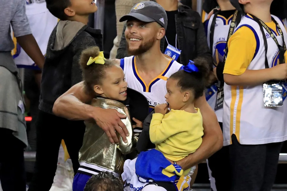 <p>Dad's little cheerleaders! Stephen beamed for more reasons than one following his team's major victory after the Golden State Warriors defeated the Cleveland Cavaliers in game five to win the 2017 NBA Finals.</p>