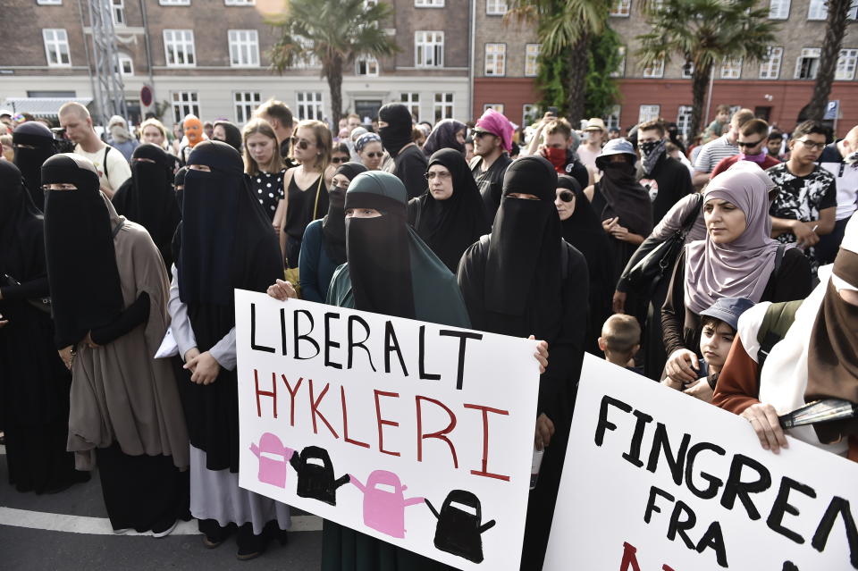 Women carry signs defending their right to wear Islamic face veils during a protest in Copenhagen on Aug. 1, 2018. (Photo: MADS CLAUS RASMUSSEN via Getty Images)