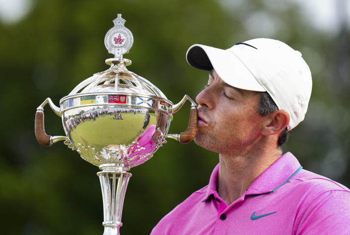 Rory McIlroy, of Northern Ireland, kisses the trophy after winning the Canadian Open golf tournament at St. George's Golf and Country Club in Toronto, Sunday, June 12, 2022. (Nathan Denette/The Canadian Press via AP)