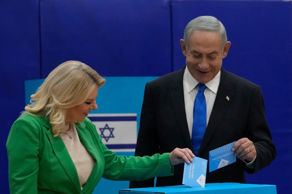 Likud party chairman Benjamin Netanyahu and his wife Sara cast their ballots during Israeli elections in Jerusalem on Tuesday, Nov. 1, 2022.