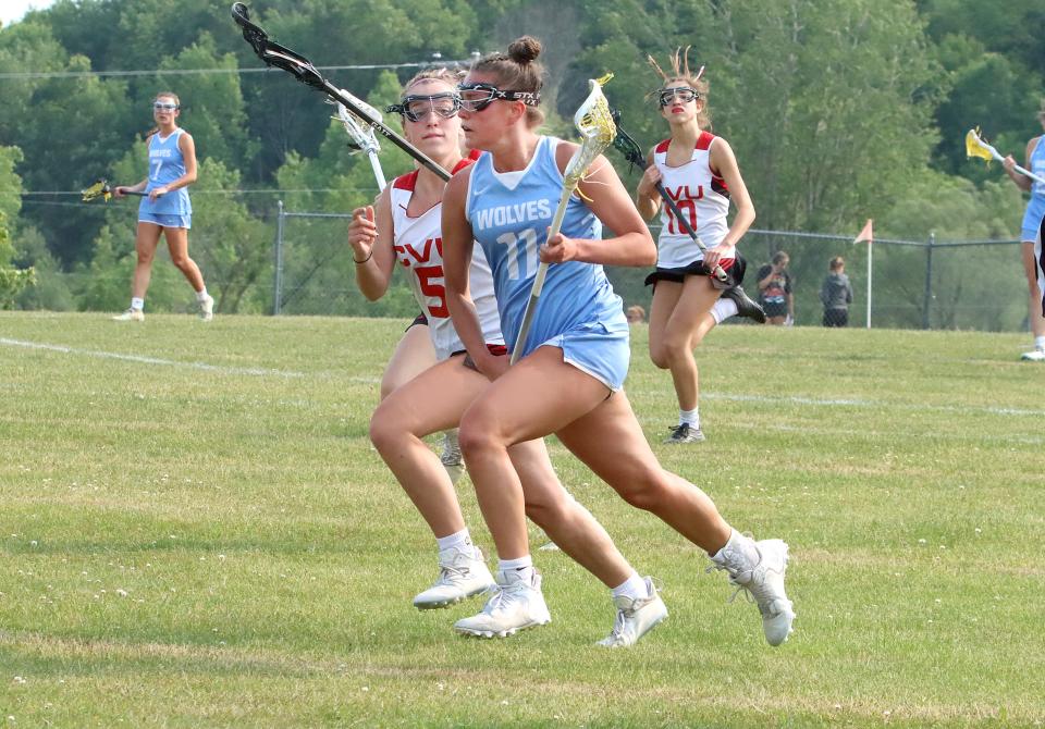 South Burlington's Miranda Hayes brings the ball up the sidelines during the Wolves 12-11 semifinal loss to CVU on Tuesday afternoon in Hinesburg.