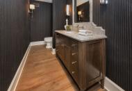 <p>The house has four full baths and one partial bath. This one is outfitted with a felt-like-textured pinstripe wallpaper. (Photo: <a href="http://bit.ly/1UCMKf2" rel="nofollow noopener" target="_blank" data-ylk="slk:Sotheby’s International Realty via Catherine Marcus;elm:context_link;itc:0;sec:content-canvas" class="link ">Sotheby’s International Realty via Catherine Marcus</a>, shot by Mark Lee)</p>