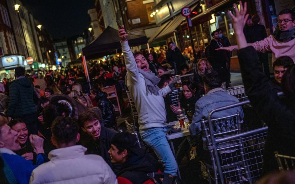 Revellers drink in Soho as non essential retail reopens - Chris J Ratcliffe 