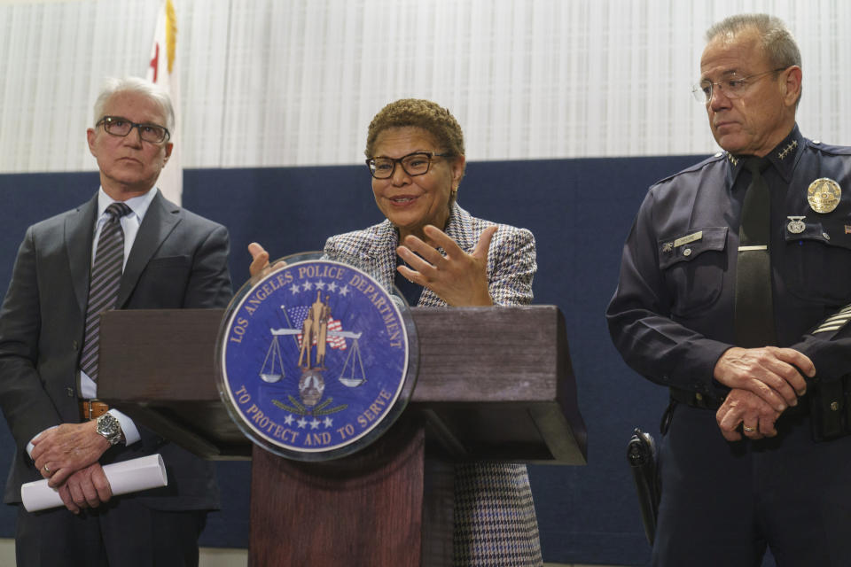 Los Angeles Mayor Karen Bass, center, flanked by District Attorney General of Los Angeles George Gascon and Los Angeles Police Chief Michel Moore, announces the arrest of a suspect in three recent killings of homeless men, Saturday, Dec. 2, 2023, in Los Angeles. (AP Photo/Damian Dovarganes)
