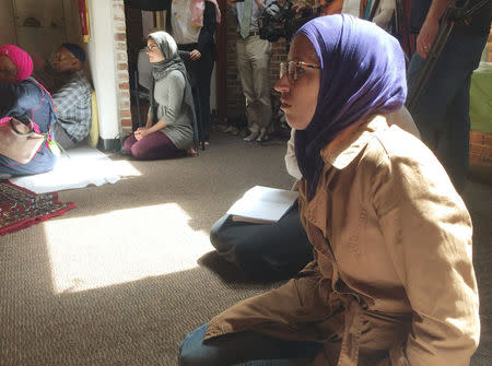 Worshipers sit and listen to prayers and a sermon at the Qal'bu Maryam Women's Mosque which held its first service on Good Friday, at the Starr King School for the Ministry in Berkeley, California, U.S., April 14, 2017. REUTERS/Lisa Fernandez