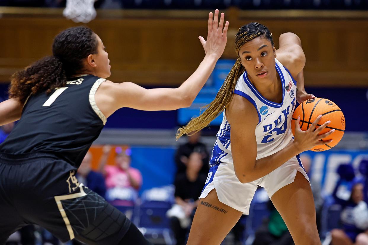 Duke's Reigan Richardson (24) looks to pass the ball around Colorado's Tayanna Jones (1) during the first half of a second-round college basketball game in the NCAA Tournament, Monday, March 20, 2023, in Durham, N.C. (AP Photo/Karl B. DeBlaker)