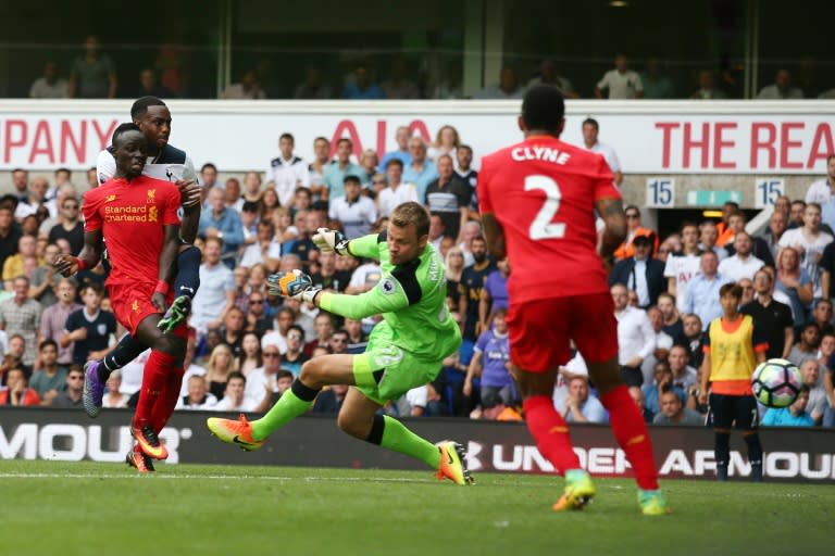 Tottenham's English defender Danny Rose (L) scores past Liverpool goalkeeper Simon Mignolet during the Premier League match at White Hart Lane in London, on August 27, 2016