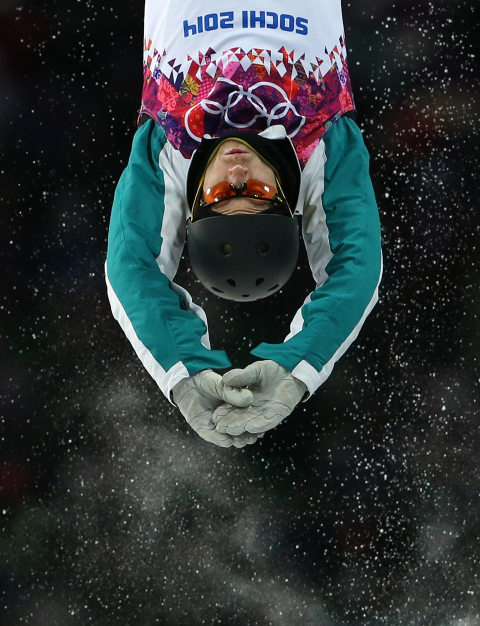 Australia's David Morris jumps during the men's freestyle skiing aerials final at the Rosa Khutor Extreme Park, at the 2014 Winter Olympics, Monday, Feb. 17, 2014, in Krasnaya Polyana, Russia. (AP Photo/Sergei Grits)