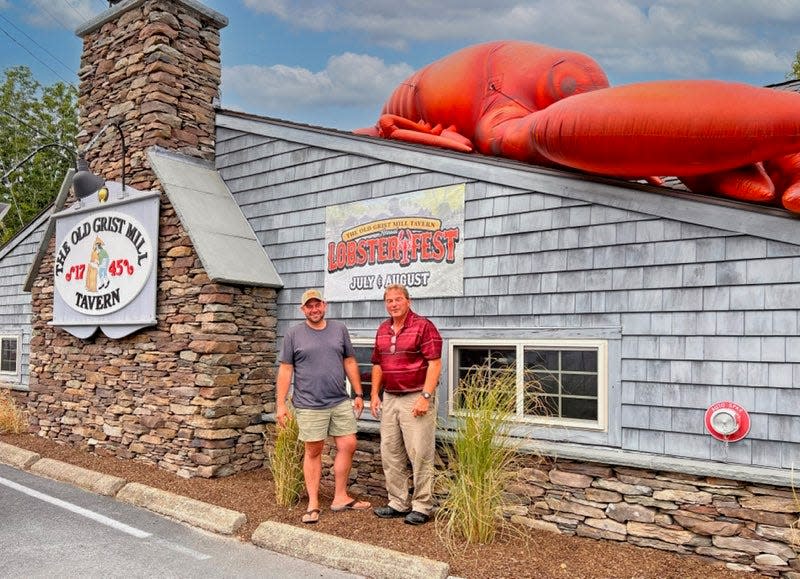 Karl Pelletier, left, who owns Tipsy Toboggan in Fall River and manages Old Grist Mill, and Greg Esmay, of Somerset, the current owner of Old Grist Mill, stand in front of the historic Seekonk restaurant.