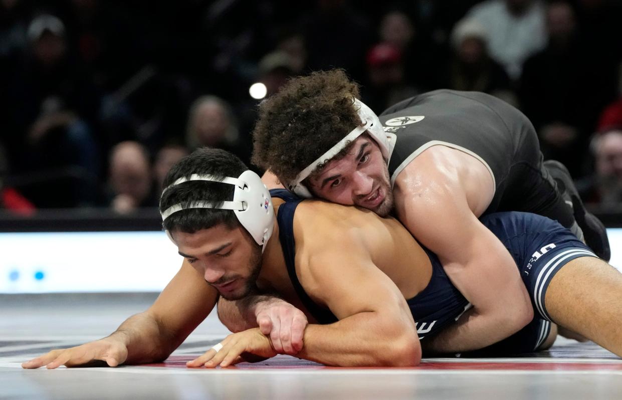 Ohio State University wrestler Sammy Sasso defeats Penn State's Shayne Van Ness in the 149-pound weight class on Feb. 3, 2023 at the Covelli Center in Columbus.