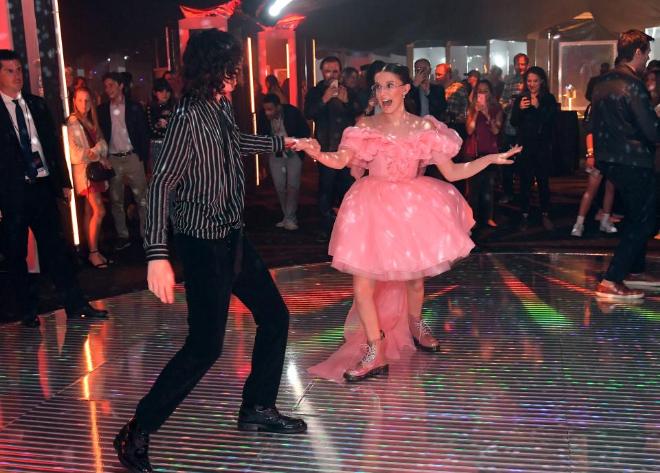 Finn Wolfhard and Millie Bobby Brown get the dance party started at the 