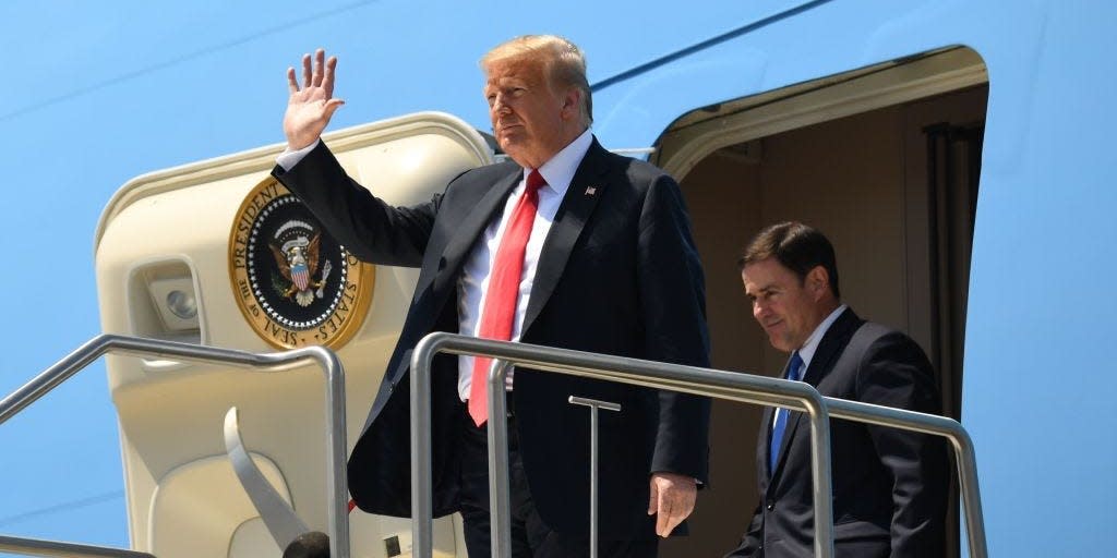 President Donald Trump (left) and Arizona Governor Doug Ducey disembark from Air Force One upon arrival in Phoenix, Arizona, on June 23, 2020.