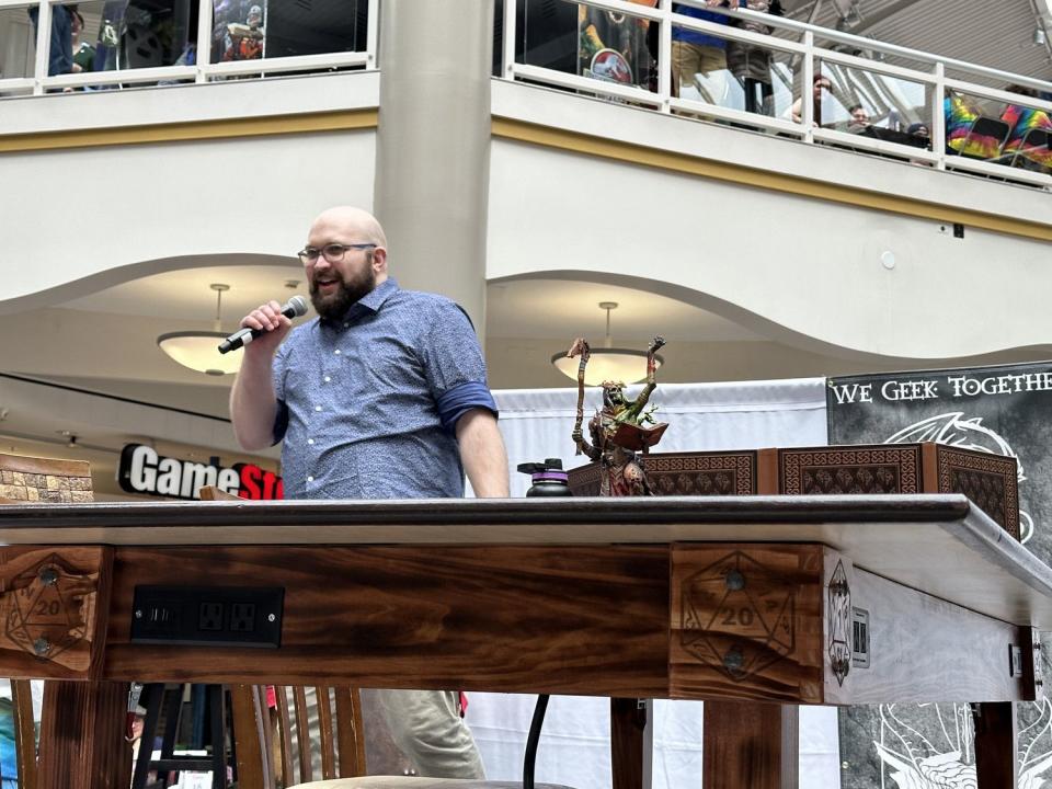 Head dungeon master Dax Levine tells participants the villain Vecna has broken down the city's walls during their Dungeons and Dragons campaign Saturday at Provo Towne Centre.