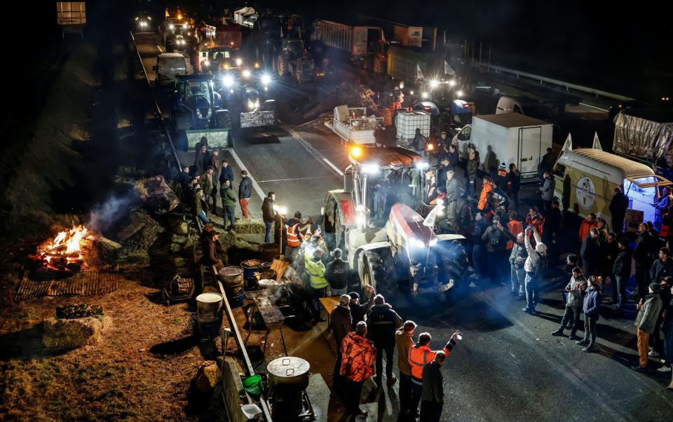 Dozens of French farmers formed a road blockade in Jossigny, east of Paris