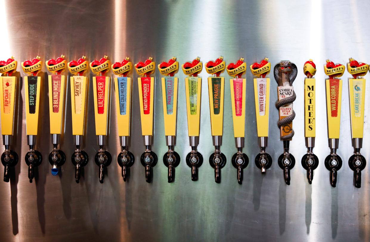 Tap handles in the Mother's Brewing Company TapRoom on Wednesday, May 3, 2023.