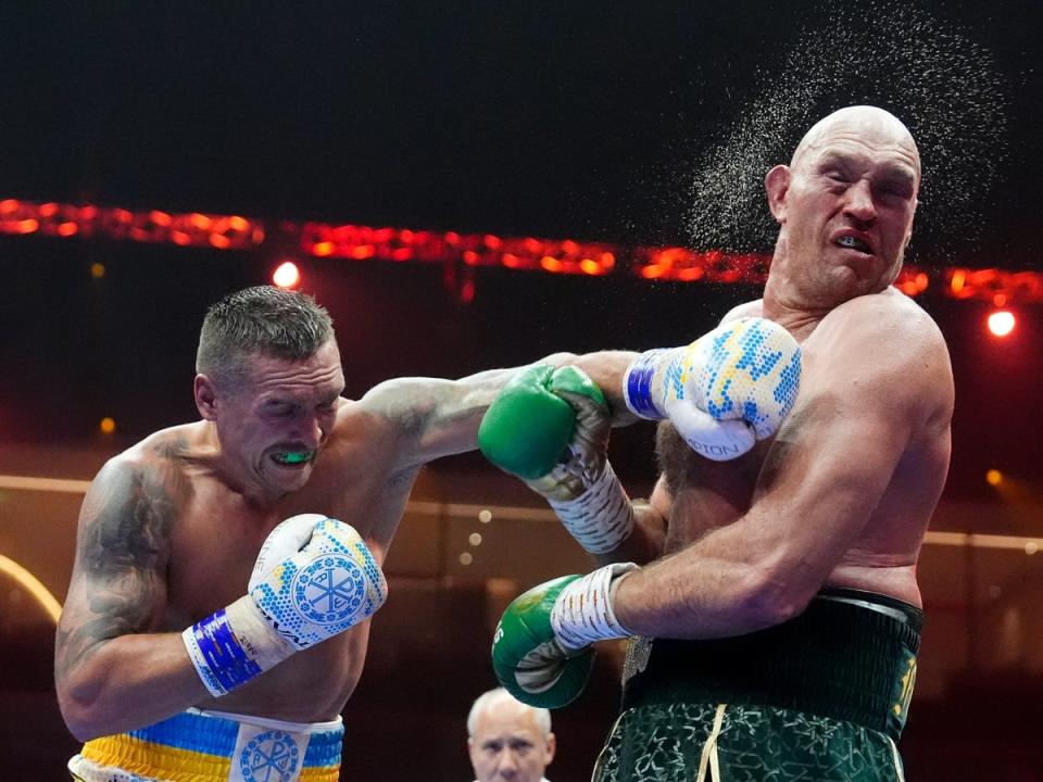 Usyk lands a punch on Fury (Nick Potts/PA Wire)