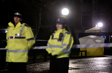 Police officers stand guard beside a cordoned-off area, after former Russian military intelligence officer Sergei Skripal, who was convicted in 2006 of spying for Britain, became critically ill after exposure to an unidentified substance, in Salisbury, southern England, March 5, 2018. REUTERS/Toby Melville
