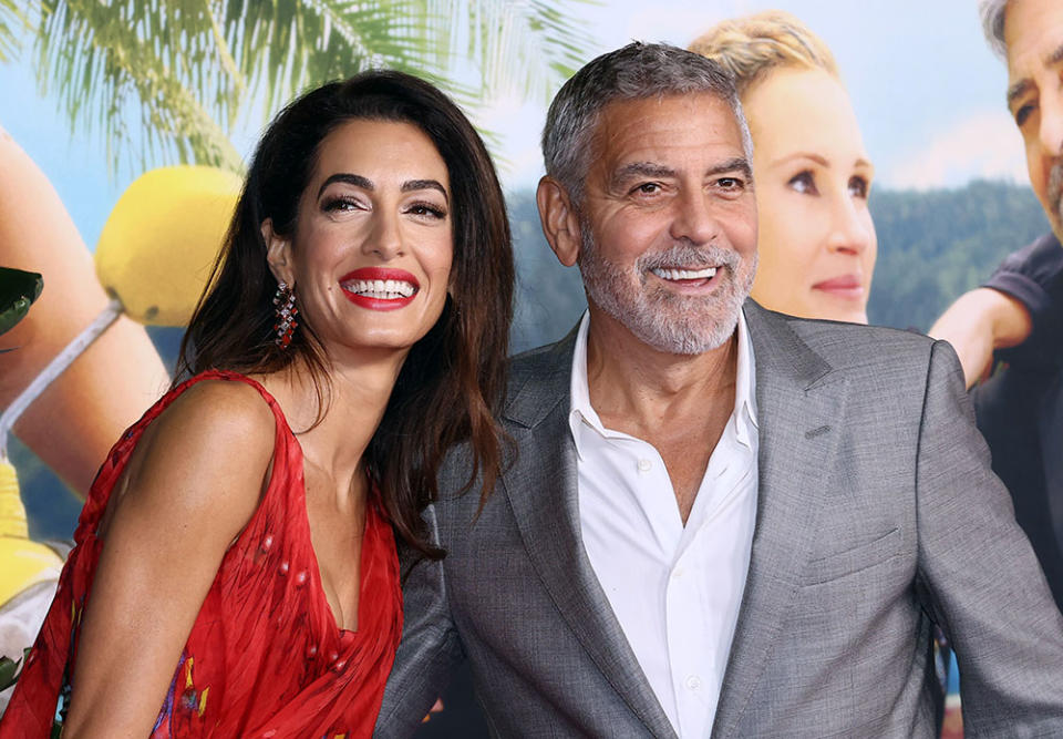 Amal Clooney and George Clooney attend the premiere of Universal Pictures' "Ticket To Paradise" at Regency Village Theatre on October 17, 2022 in Los Angeles, California.