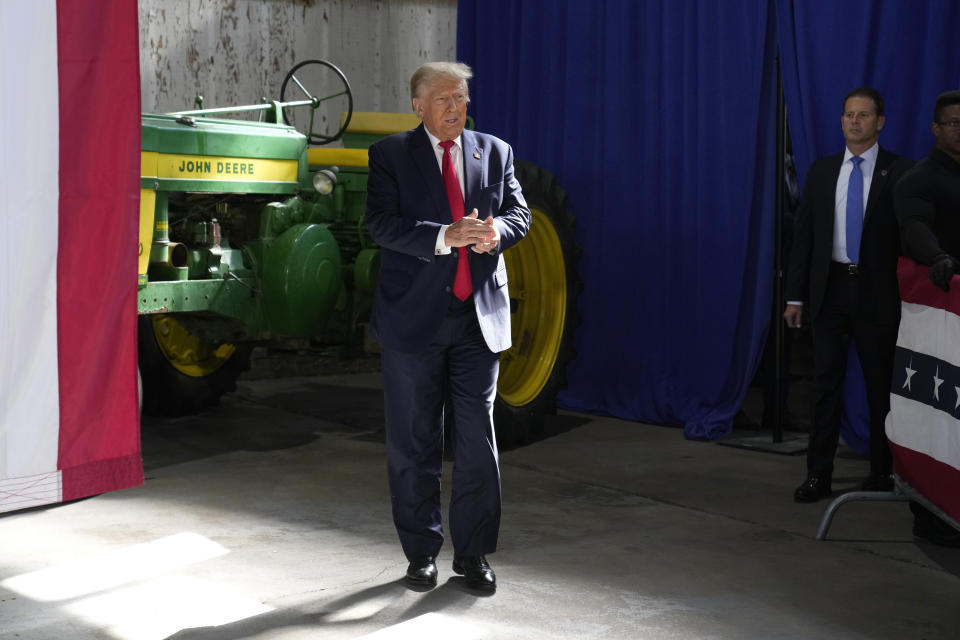 Former President Donald Trump arrives at a commit to caucus rally, Saturday, Oct. 7, 2023, in Waterloo, Iowa. (AP Photo/Charlie Neibergall)