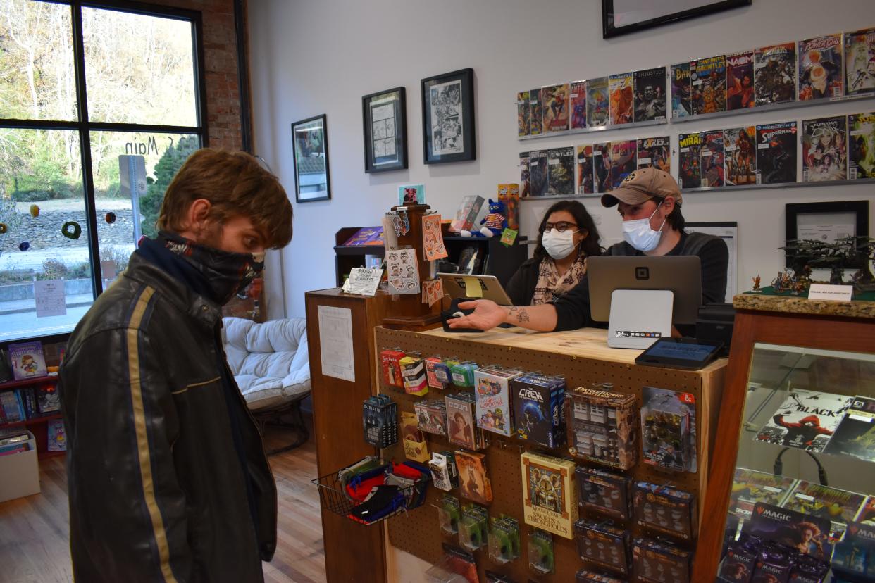 "This is the first comic book shop that I know of in the area. I just got into (comics). It was a perfect time for them to open," said Brandon, pictured at left next to owners Avia Perez and Kyle Clark.