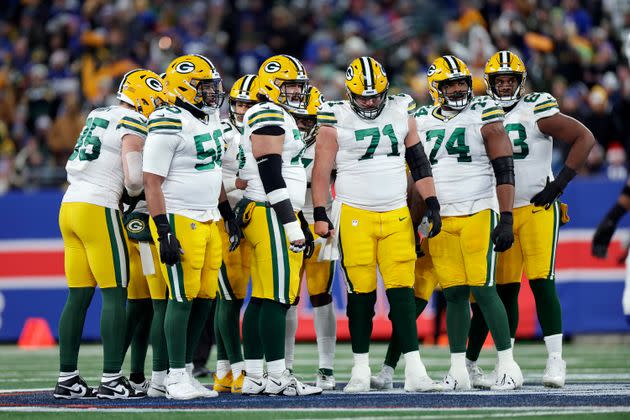 Green Bay Packers players huddle after a Dec. 11 game with the New York Giants.