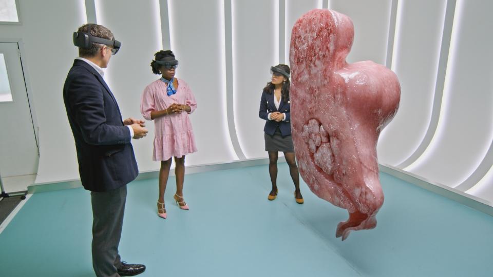 Programme Name: Your Body Uncovered with Kate Garraway - TX: n/a - Episode: Your Body Uncovered with Kate Garraway - Ep1 (No. 1) - Picture Shows: Mr Stephen Quinn, Hilda and Dr Guddi Singh looking at the GFX representation of a cross section of Hildaâ€™s uterus and fibroids therein  - (C) Rmearkable TV - Photographer: Remarkable TV