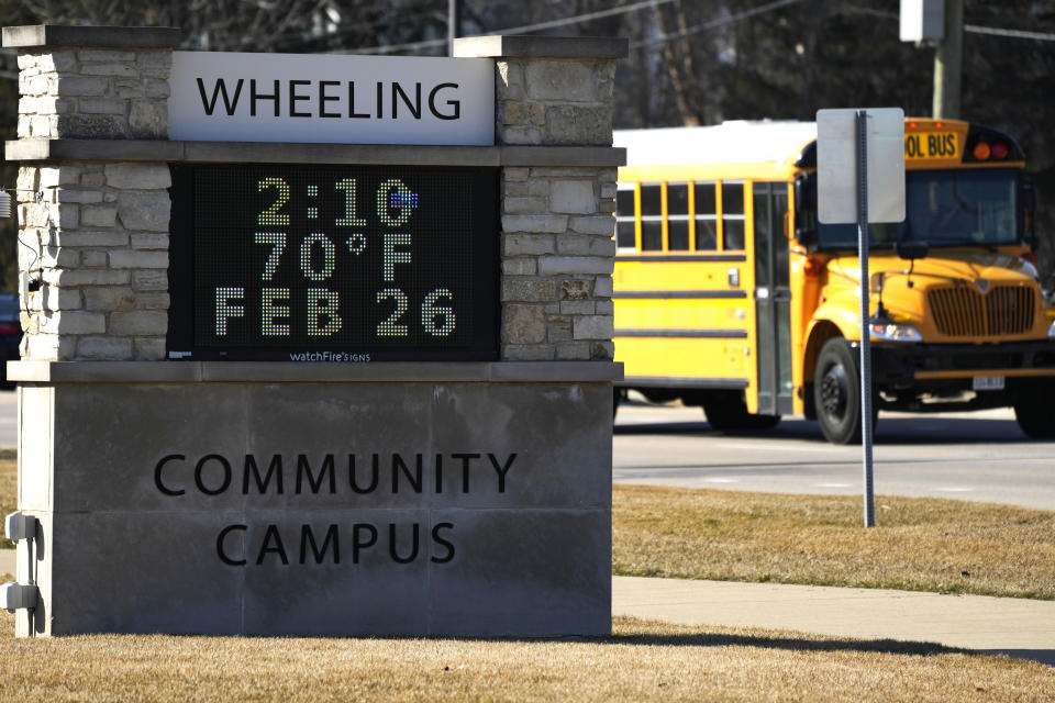 A sign shows the current outdoor temperature in the Chicago suburb of Wheeling, Ill., Monday, Feb. 26, 2024. Record warmth is expected today and Tuesday. All time February highest temperature records could also be tied or broken in Illinois. (AP Photo/Nam Y. Huh)