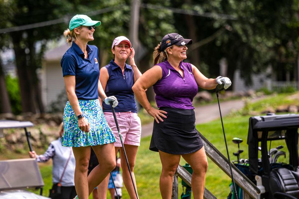 Isabelle Engelsted, Jillian Grolley and Jillian Blanchard are all smiles on the course at the CCNB Women's Fourball Tournament.