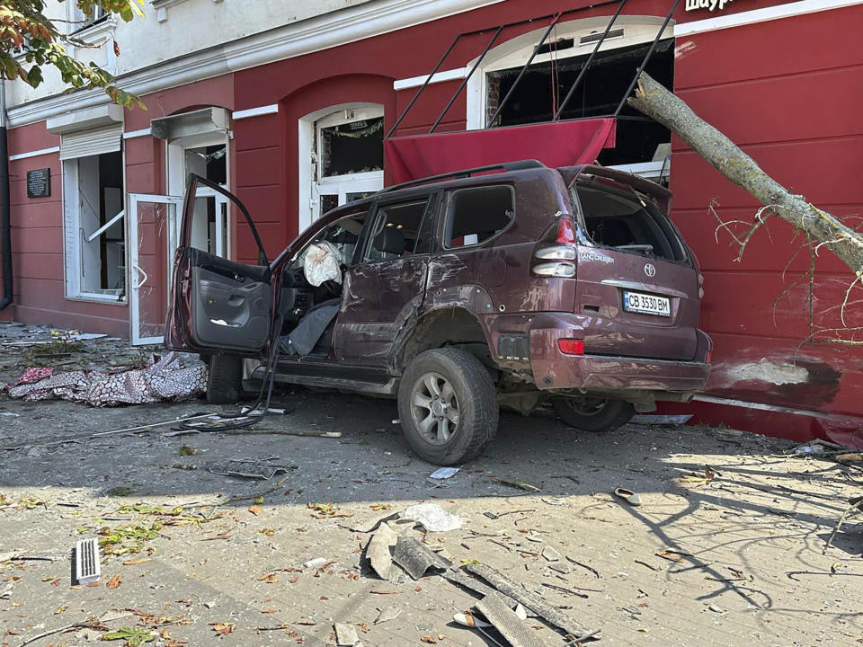 In this photo provided by the Ukrainian Emergency Service, a car is seen damaged by Russian attack in Chernihiv, Ukraine, Saturday, Aug. 19, 2023. (Ukrainian Emergency Service via AP)