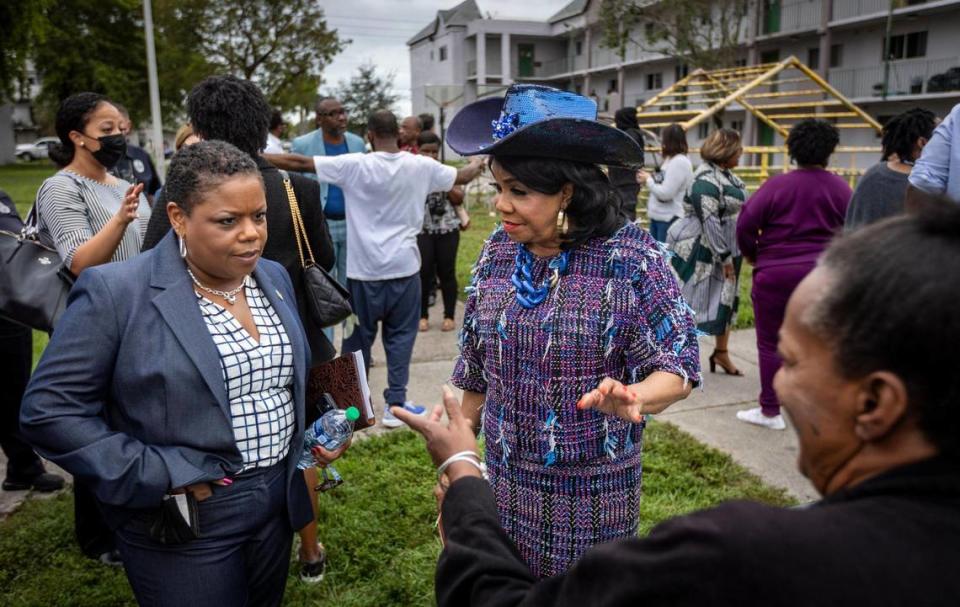 Opa-locka, Florida, January 8, 2024 - Congresswoman Fredericka Wilson, right and HUD Southeast Regional Director Jennifer Collins, left, talk to a resident of Glorieta Gardens during their visit.