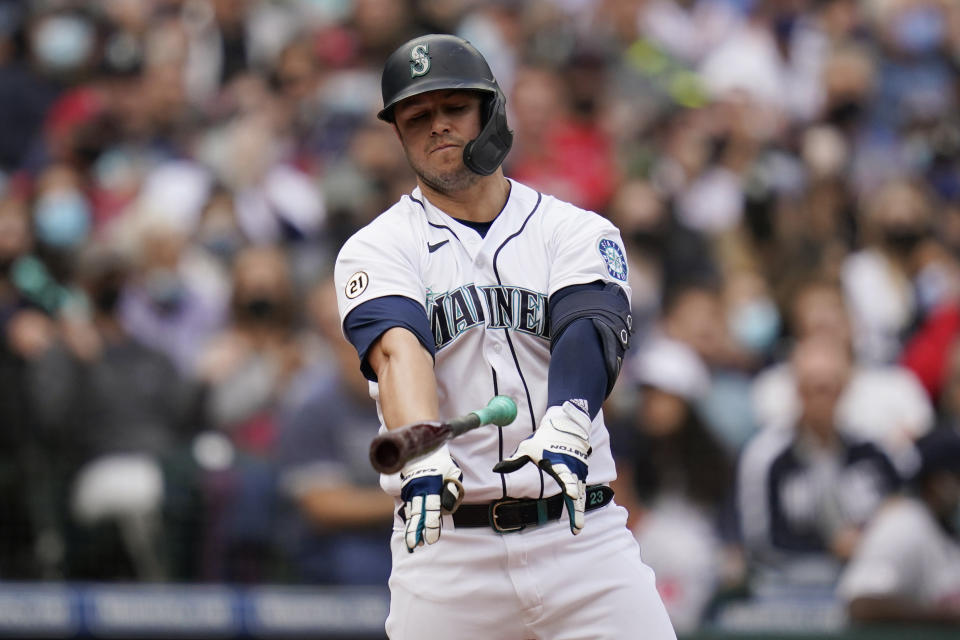 Seattle Mariners' Ty France slams down his bat after striking out swinging against the Boston Red Sox to end the third inning of a baseball game Wednesday, Sept. 15, 2021, in Seattle. (AP Photo/Elaine Thompson)