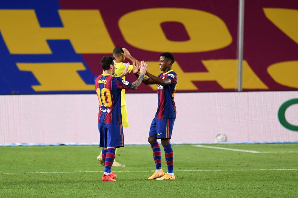 BARCELONA, SPAIN - SEPTEMBER 27: Lionel Messi and Ansu Fati of FC Barcelona celebrate their team's fourth goal during the La Liga Santander match between FC Barcelona and Villarreal CF at Camp Nou on September 27, 2020 in Barcelona, Spain. Football Stadiums around Europe remain empty due to the Coronavirus Pandemic as Government social distancing laws prohibit fans inside venues resulting in fixtures being played behind closed doors. (Photo by David Ramos/Getty Images)