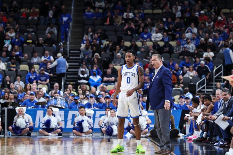 Kentucky guard Rob Dillingham talks with head coach John Calipari during the Wildcats’ loss to Oakland in the NCAA Tournament on March 21. That was Calipari’s final game with the Cats after 15 seasons in charge of the program.