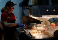 An employee cooks French fries at a McDonald's restaurant in Moscow, Russia April 24, 2018. Picture taken April 24, 2018. REUTERS/Tatyana Makeyeva