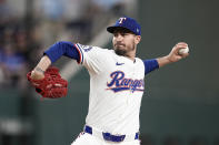 Texas Rangers starting pitcher Andrew Heaney throws to the Seattle Mariners in the first inning of a baseball game in Arlington, Texas, Thursday, April 25, 2024. (AP Photo/Tony Gutierrez)