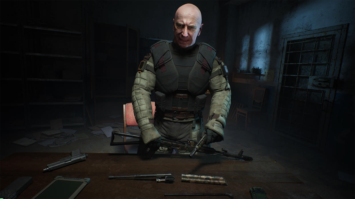  Stalker 2 screenshot - man standing in front of a table with a gun. 