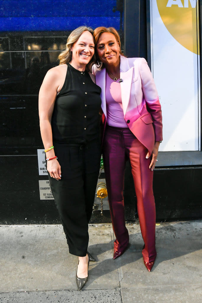 Laign and Roberts standing outside together