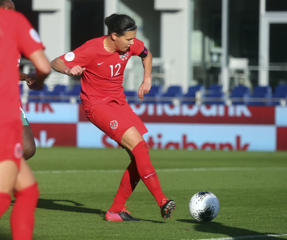 Canada's Christine Sinclair scores against St. Kitts and Nevis during a CONCACAF women's Olympic qualifying soccer match Wednesday, Jan. 29, 2020, in Edinburg, Texas. Sinclair scored her 184th goal, passing Abby Wambach for first place. (Joel Martinez/The Monitor via AP)