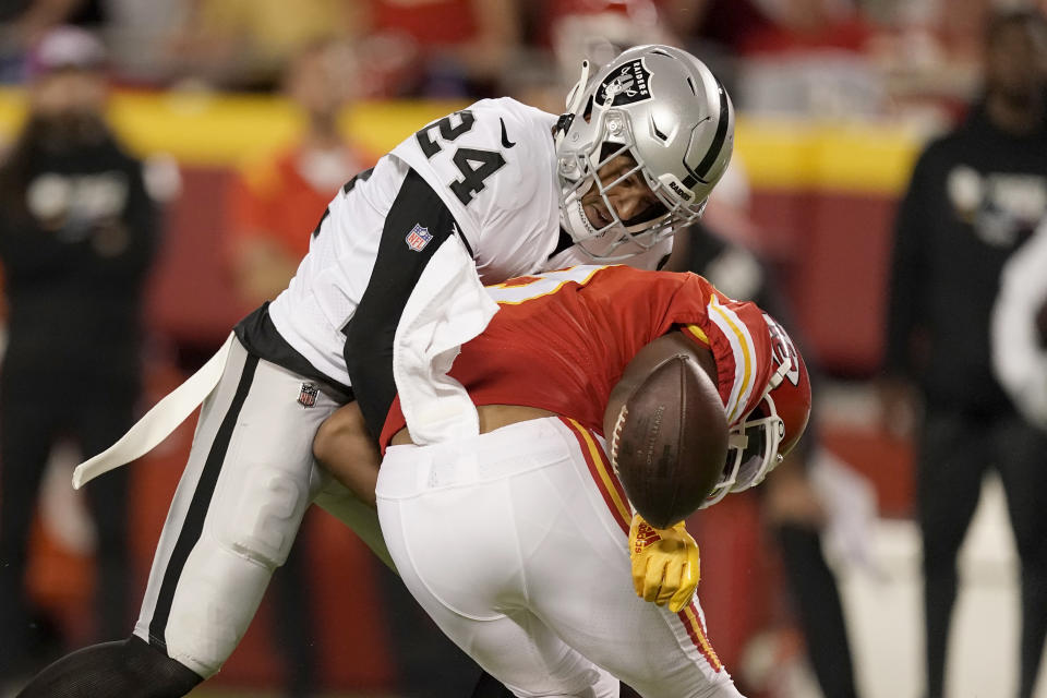 Las Vegas Raiders safety Johnathan Abram (24) breaks up a pass intended for Kansas City Chiefs wide receiver JuJu Smith-Schuster during the first half of an NFL football game Monday, Oct. 10, 2022, in Kansas City, Mo. (AP Photo/Charlie Riedel)