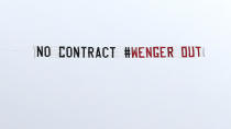 <p>General view of a plane flying overhead with a message directed at Arsenal manager Arsene Wenger before the match </p>