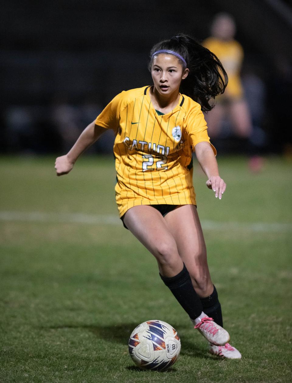 Caroline Trajano (22) controls the ball during the Walton vs Catholic girls playoff soccer game at Pensacola Catholic High School on Monday, Jan. 29, 2024.