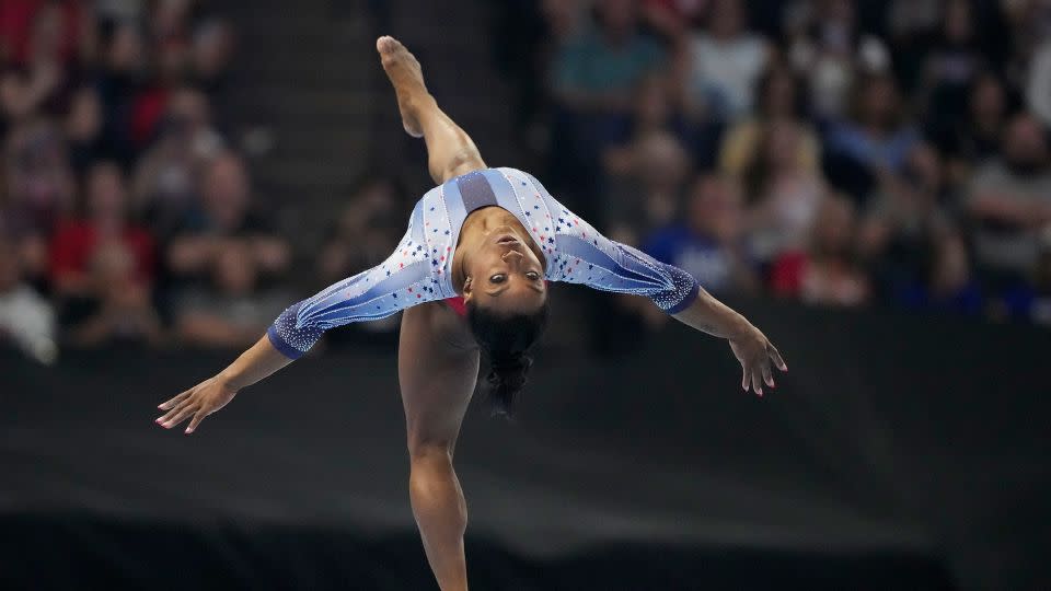 Simone Biles competes on the balance beam at the United States Gymnastics Olympic Trials in Minneapolis, Minnesota on June 28, 2024. - Charlie Riedel/AP