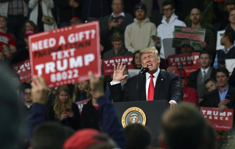 President Trump speaks on Friday at a campaign-style rally in Pensacola, Fla. The White House has said the rally is a campaign event for Trump, but the location near the Alabama border and with television markets in the state stoked speculation that the rally was a backdoor way for the president to give Moore’s campaign a boost without actually setting foot in the state. (Photo: Susan Walsh/AP)