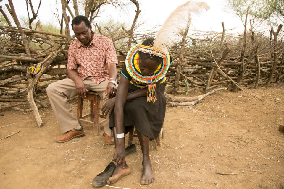 Cheposait Adomo, seated with Dr. Michael Makari, head of Kacheliba hospital in Kenya's West Pokot, describes how she was bitten repeatedly by a black mamba. (Photo: Zoe Flood)