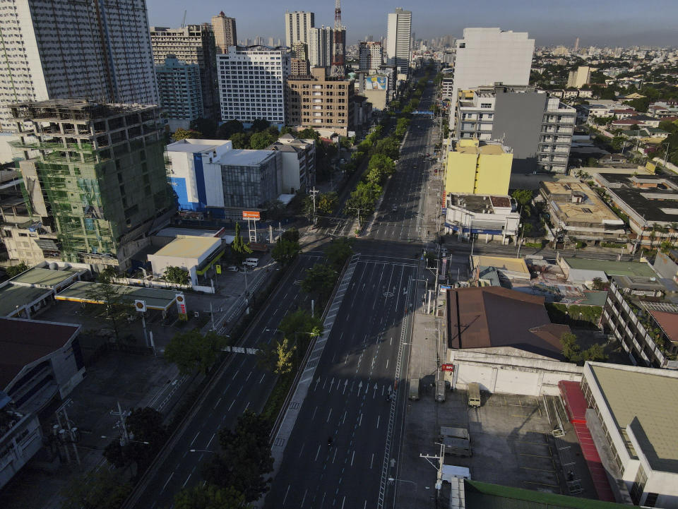 An almost empty Quezon Boulevard is seen as the government implements a strict lockdown to prevent the spread of the coronavirus on Good Friday, April 2, 2021 in Quezon city, Philippines. Filipinos marked Jesus Christ's crucifixion Friday in one of the most solemn holidays in Asia's largest Catholic nation which combined with a weeklong coronavirus lockdown to empty Manila's streets of crowds and heavy traffic jams. Major highways and roads were eerily quiet on Good Friday and churches were deserted too after religious gatherings were prohibited in metropolitan Manila and four outlying provinces. (AP Photo/Aaron Favila)