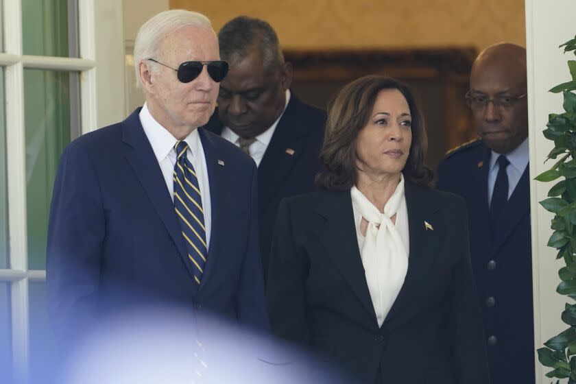 President Joe Biden and Vice President Kamala Harris, followed by Defense Secretary Lloyd Austin and U.S. Air Force Chief of Staff Gen. CQ Brown, Jr., right, walk from the Oval Office to speak in the Rose Garden of the White House in Washington, Thursday, May 25, 2023, on his intent to nominate Brown to serve as the next Chairman of the Joint Chiefs of Staff. (AP Photo/Susan Walsh)