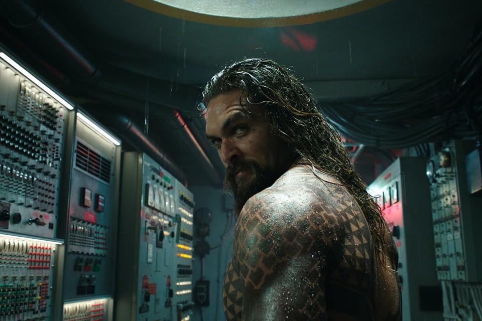 Muscleman Momoa: The actor normally shows off his gym-honed physique in films (Warner Bros)